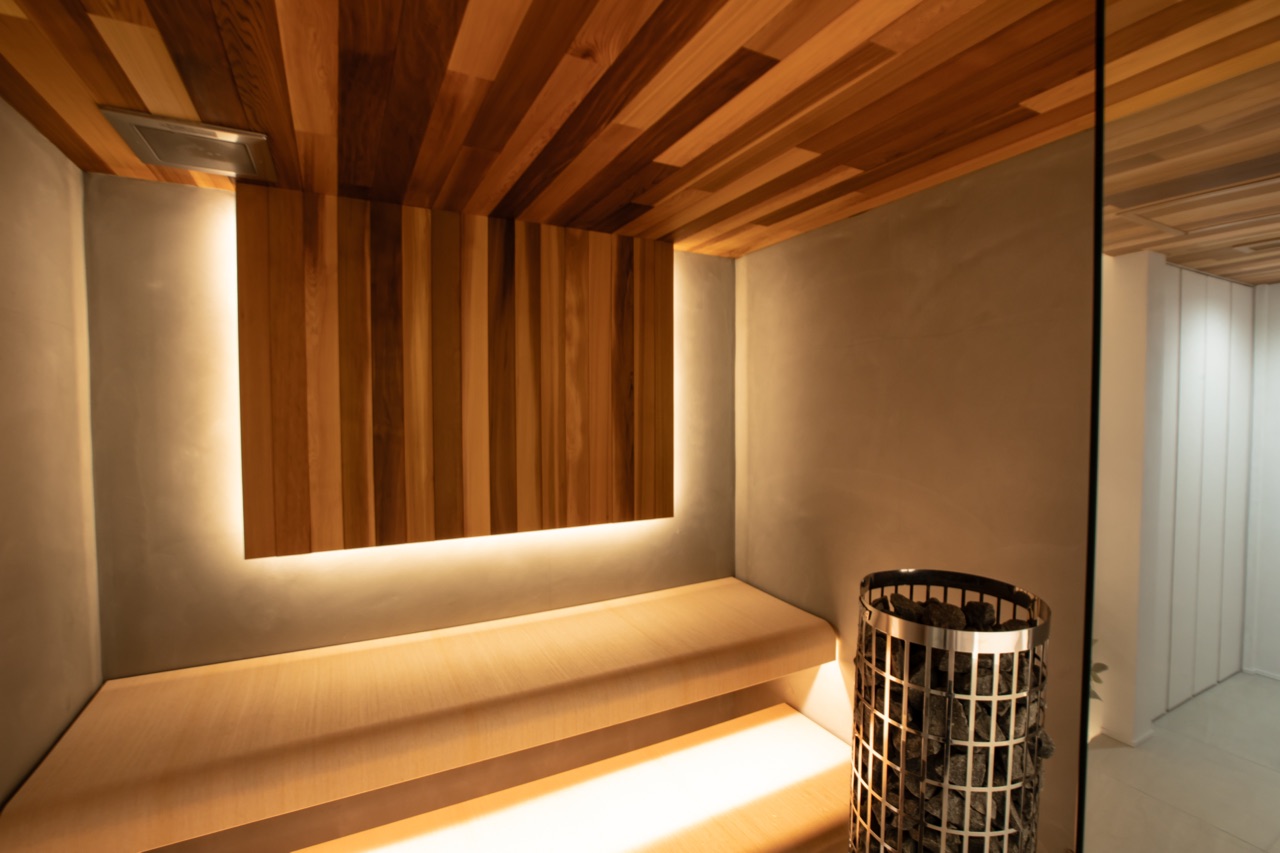 Private sauna interior — cedar walls and soft lighting